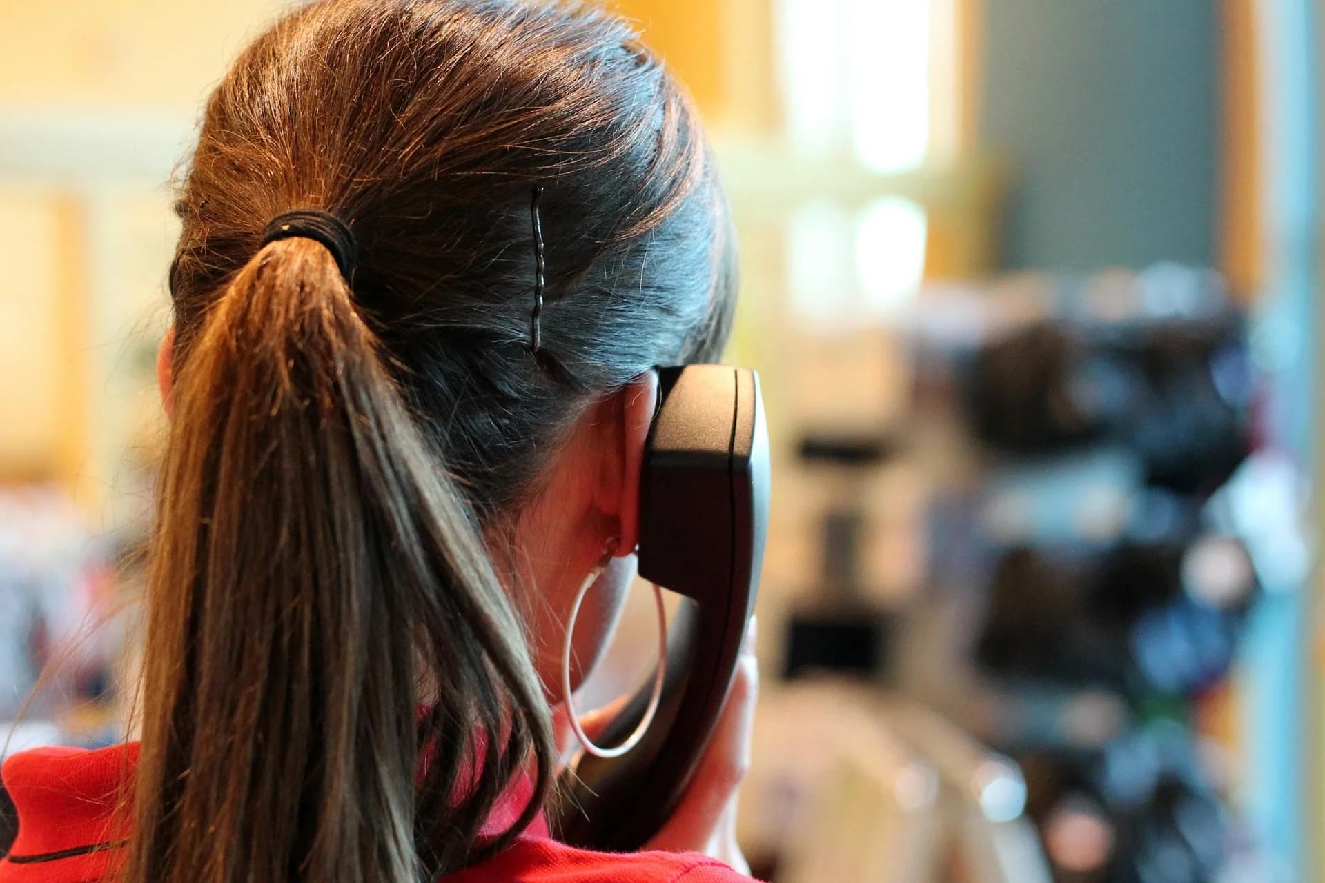 Customer service professional speaking on a telephone